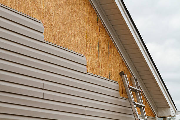 Professional Storm Damage Siding Repair technician working in Pershing, IN